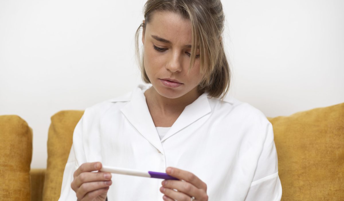 medium-shot-woman-checking-pregnancy-test