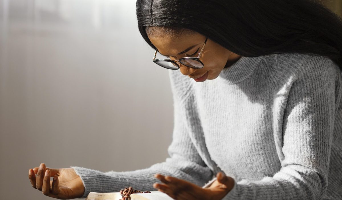 young-woman-praying-her-loved-ones